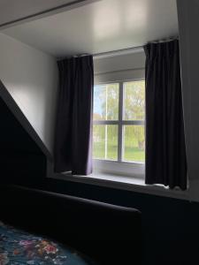 Postel nebo postele na pokoji v ubytování B&B Catharinenburg Golf & Wellness