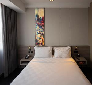 Postel nebo postele na pokoji v ubytování Citadines Connect Airport Jakarta + 17 fotografií