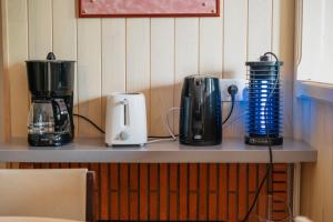 a counter with three appliances on top of it at La maison de la Rebergère in Javené