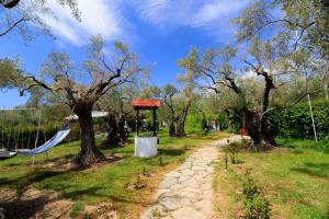a park with a swing set and trees at Ai Giorgis Beach in Alexandroupoli +23 photos
