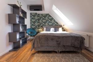 Postel nebo postele na pokoji v ubytování Urban Design Suites Nürnberg