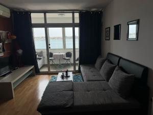 a living room with a couch and a table at Lorena app in Umag