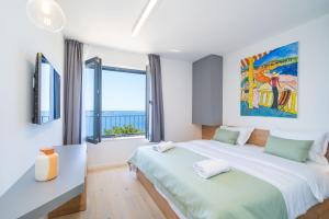 Postel nebo postele na pokoji v ubytování Soline Rocks Resort