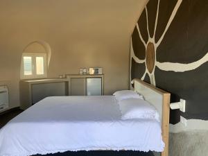 Letto o letti in una camera di Nausicaa Guesthouse