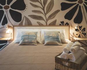 Letto o letti in una camera di Nausicaa Guesthouse