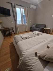 A bed or beds in a room at Closer "Egnatia Apartment 4"
