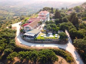 an aerial view of a house on a hill at Forestata Village in Lixouri