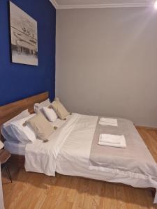 A bed or beds in a room at Closer "Egnatia Apartment 4"