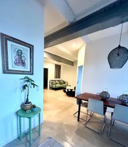 a living room with a table and a couch at Elegance Centre Sète in Sète +8 photos