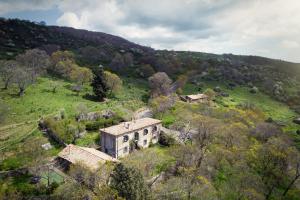 an old house on the side of a hill at Dimora Storica Dei Nelson in Maniace