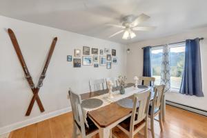 a dining room with a table and chairs and a ceiling fan at Uncas 16N - Spacious & Scenic Townhome in North Creek +13 photos