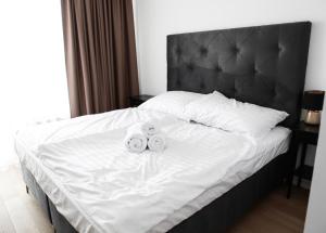 two rolls of towels sitting on top of a bed at Klingerka in Bratislava