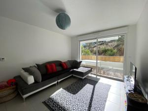 Χώρος καθιστικού στο Appartement cosy proche centre Capbreton, situé dans un cadre boisé