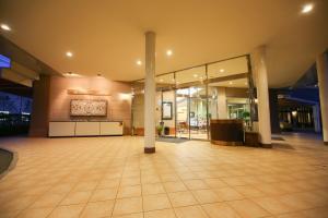 a lobby of a building with a large room with columns at Hotel Marital Sousei Kurume in Kurume