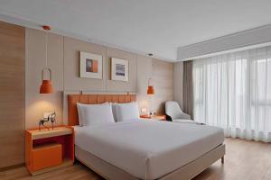Postel nebo postele na pokoji v ubytování OneJasper Horizon Hotel