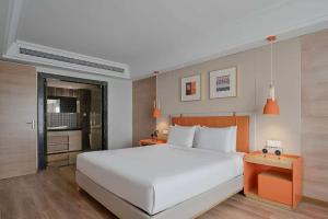 Postel nebo postele na pokoji v ubytování OneJasper Horizon Hotel