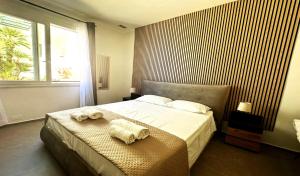 Ένα ή περισσότερα κρεβάτια σε δωμάτιο στο CH Exclusive Apartments