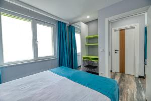 Postel nebo postele na pokoji v ubytování Grisverde Suites Hotel