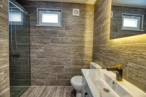 Koupelna v ubytování Grisverde Suites Hotel