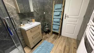 a bathroom with a sink and a shower at Paco Homestay in Saint-Germain-sur-Morin +32 photos