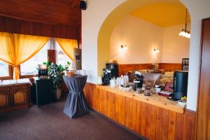 a kitchen with a counter with a counter at Penzion PANORAMA Janovičky in Broumov