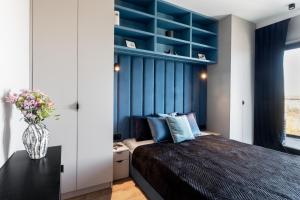 Voodi või voodid majutusasutuse Apartamenty Tespis - Góreckiego 19 next to STREFA KULTURY - SPODEK, NOSPR, MCK toas