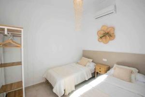 Posteľ alebo postele v izbe v ubytovaní Casa Marinero beach 3