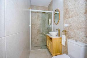 a bathroom with a shower and a toilet and a sink at Casa Marinero beach 2 in Torrox Costa +18 photos