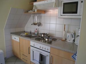 Kuchyň nebo kuchyňský kout v ubytování Haus am Deich