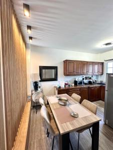 a kitchen with a table and chairs in a room at Tinos Boutique House in Tinos