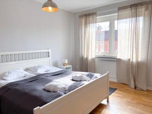 Postel nebo postele na pokoji v ubytování Säffle Suites by Svaneholm Hotel