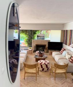 a living room with a couch and a table at Quinta do Lago, Victory Village N 63 in Almancil