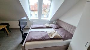 Postel nebo postele na pokoji v ubytování Moderne Apartments mit Klima, perfekter Anbindung ins Zentrum und kostenlose Parkplätze!