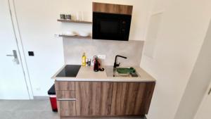 Kuchyň nebo kuchyňský kout v ubytování Moderne Apartments mit Klima, perfekter Anbindung ins Zentrum und kostenlose Parkplätze!