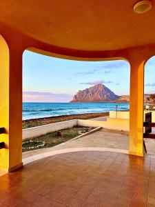 a view of the ocean and a mountain from a building at Villino Maria Elena in Valderice