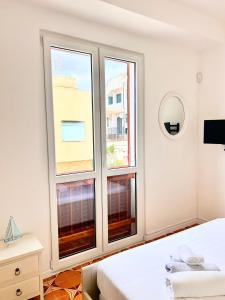 Postel nebo postele na pokoji v ubytování La casa di Vicky + 8 fotografií