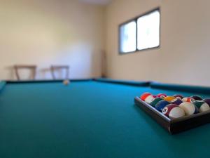a pool table with a tray of balls on it at Casa Santo Antonio in Antas