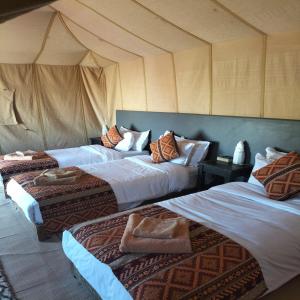 Postel nebo postele na pokoji v ubytování Magnifique Luxury Camp