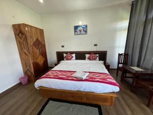 Krevet ili kreveti u jedinici u okviru objekta Lap Of Himalayas Resort