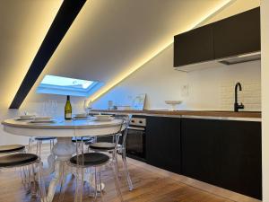 a kitchen with a table and some chairs and a counter at Explore Perugia from this Top Location in Perugia