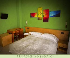 Voodi või voodid majutusasutuse Borromeo Residenze Service s.a.s toas