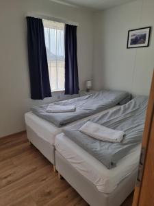 Postel nebo postele na pokoji v ubytování Litla-Hof Guesthouse