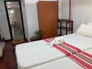 Postel nebo postele na pokoji v ubytování Grand Villa Hikkaduwa