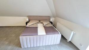 Postel nebo postele na pokoji v ubytování Moderne Apartments mit Klima, perfekter Anbindung ins Zentrum und kostenlose Parkplätze!