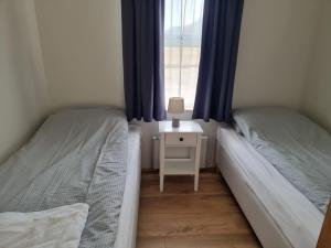 Postel nebo postele na pokoji v ubytování Litla-Hof Guesthouse