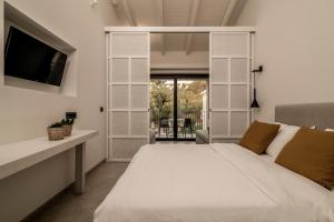 Posteľ alebo postele v izbe v ubytovaní New Beach Hotel