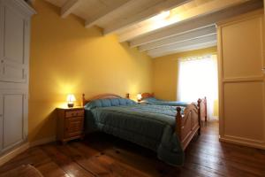 a bedroom with two beds and a window at Maison "harotcheta" in Saint-Pée-sur-Nivelle