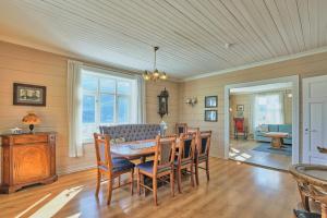 a dining room with a table and chairs at Solheim Gard in Stryn
