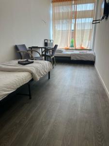 Postel nebo postele na pokoji v ubytování HH Hostels