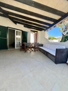 a living room with a couch and a table at VILLA MAR in Cala'n Bosch